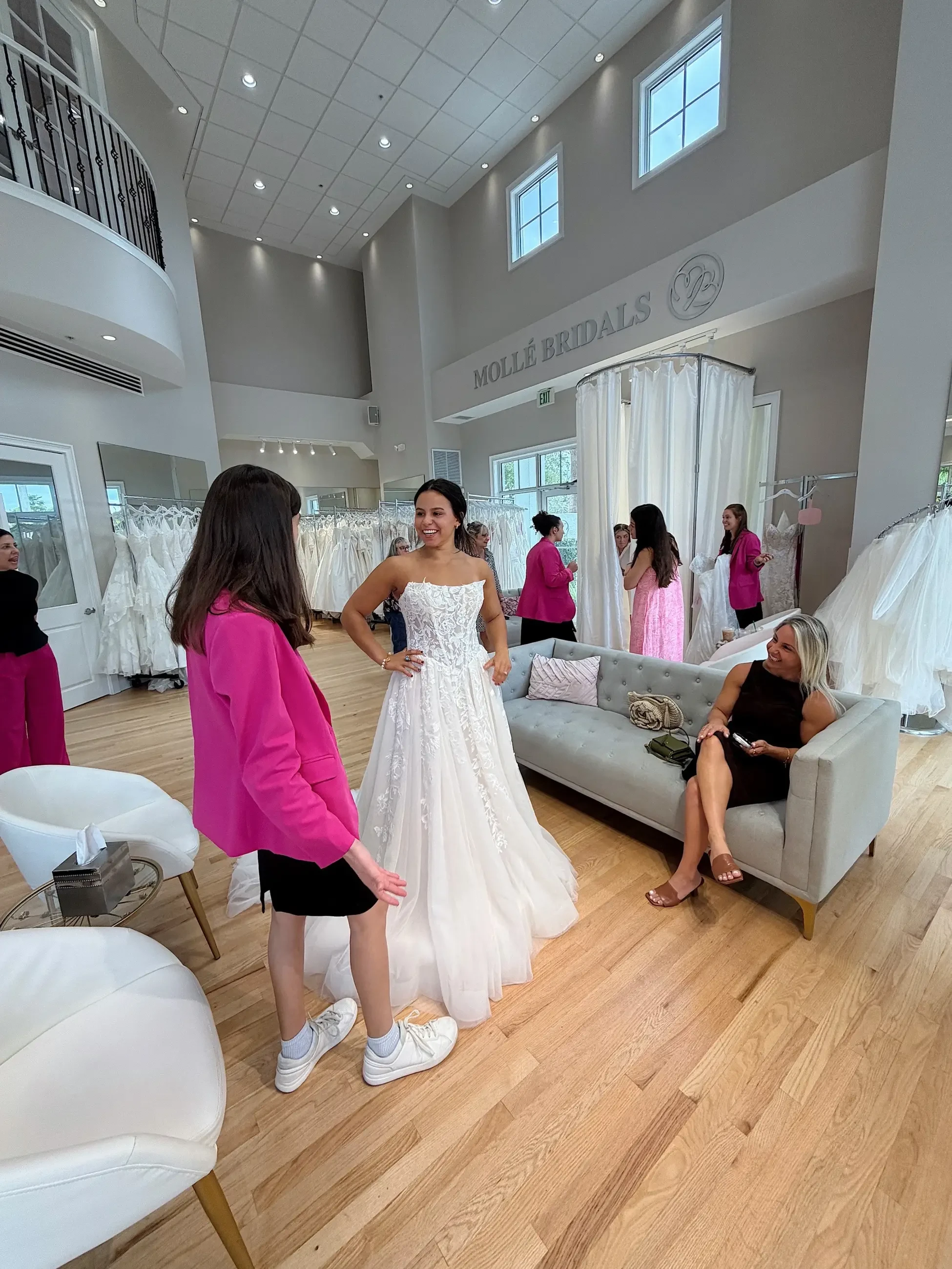 model is wearing a lace a-line bridal gown