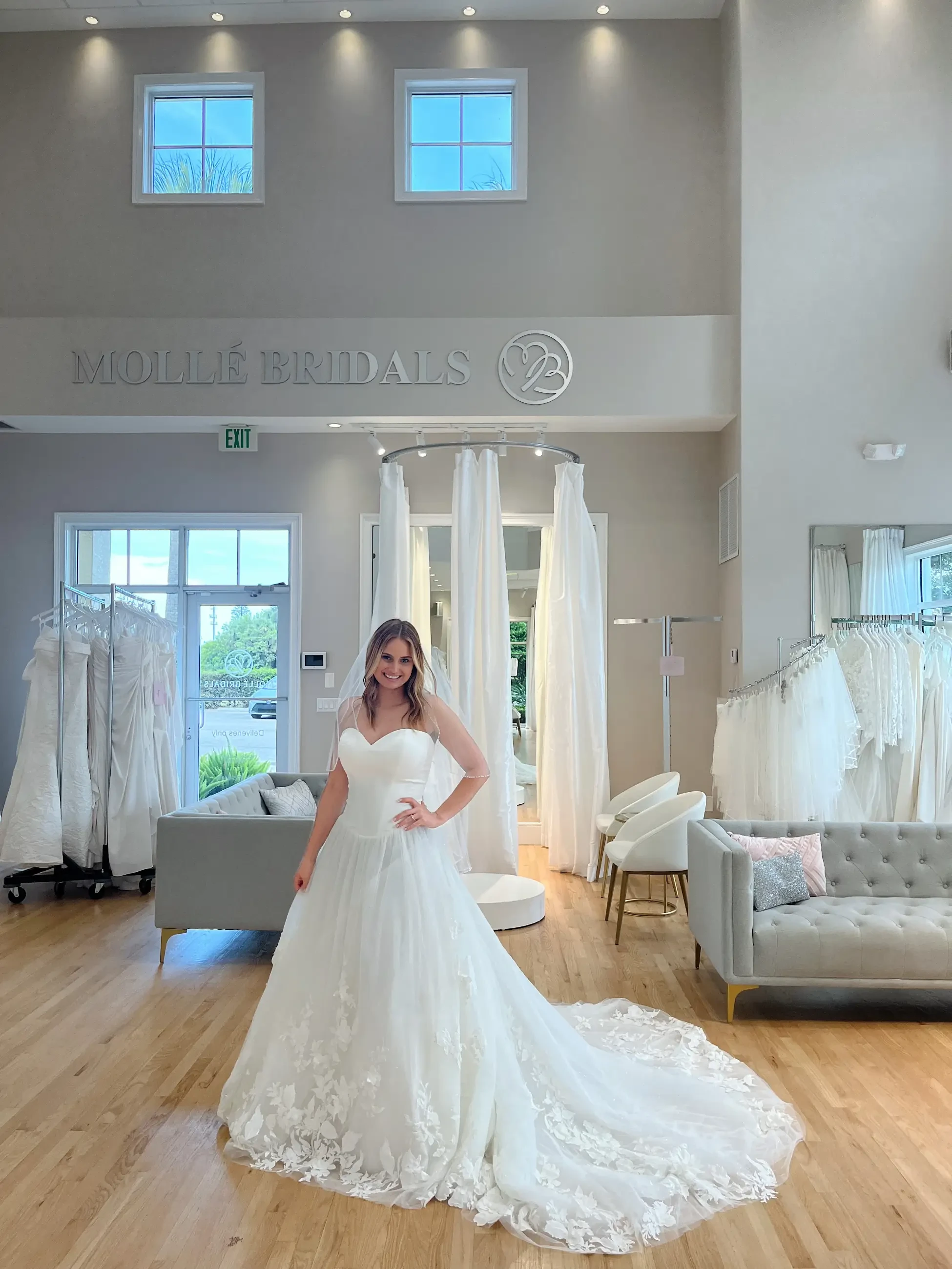 woman wears a strapless a-line wedding gown