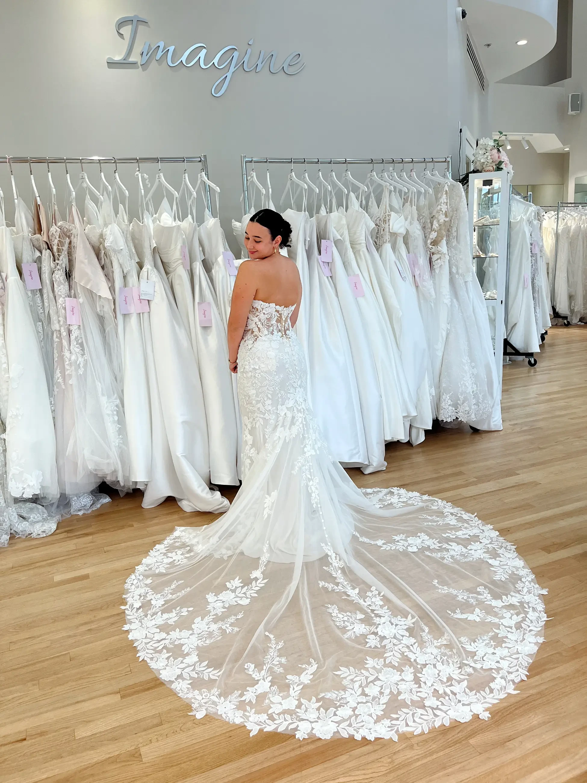 model is wearing a fitted allover lace wedding dress