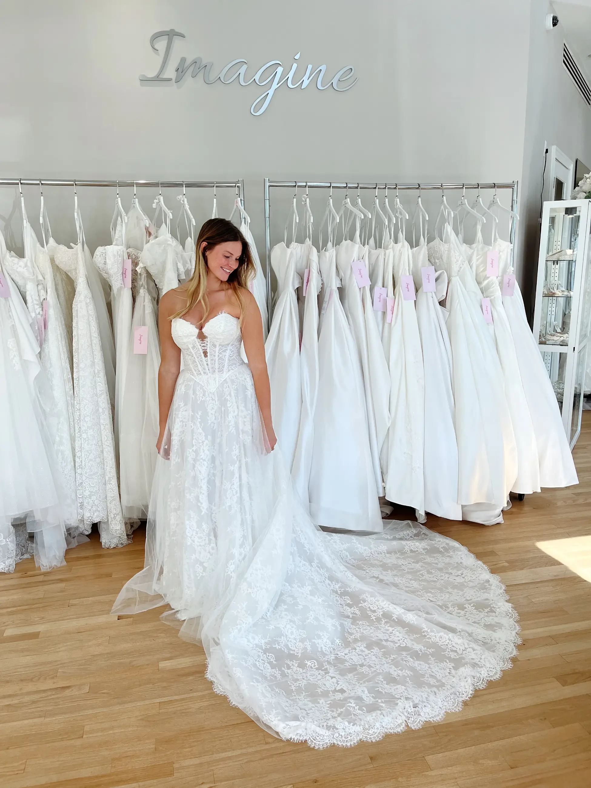 model is wearing a sleeveless a-line bridal gown