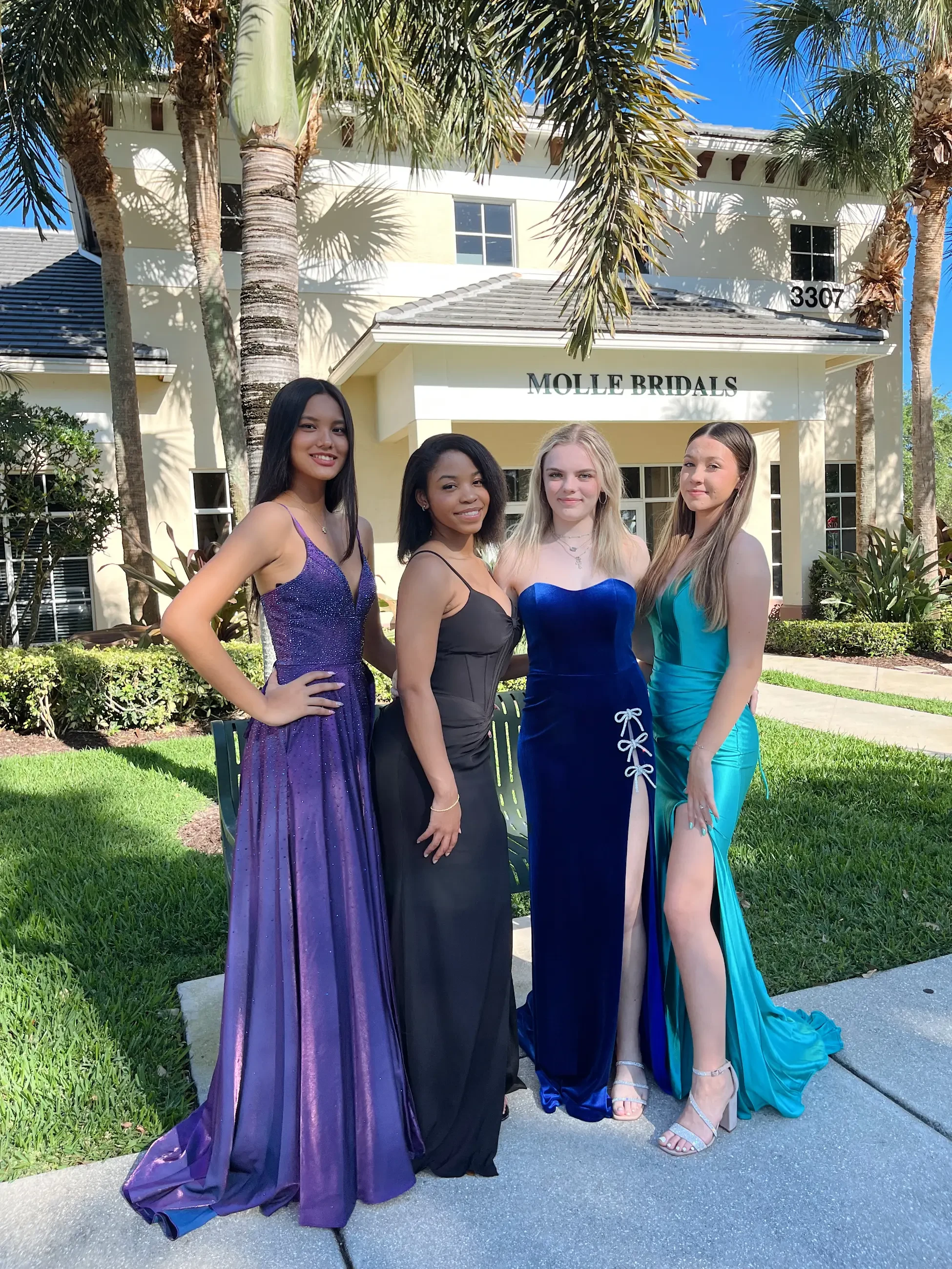 image shows four models wearing evening gowns in a variety of textures