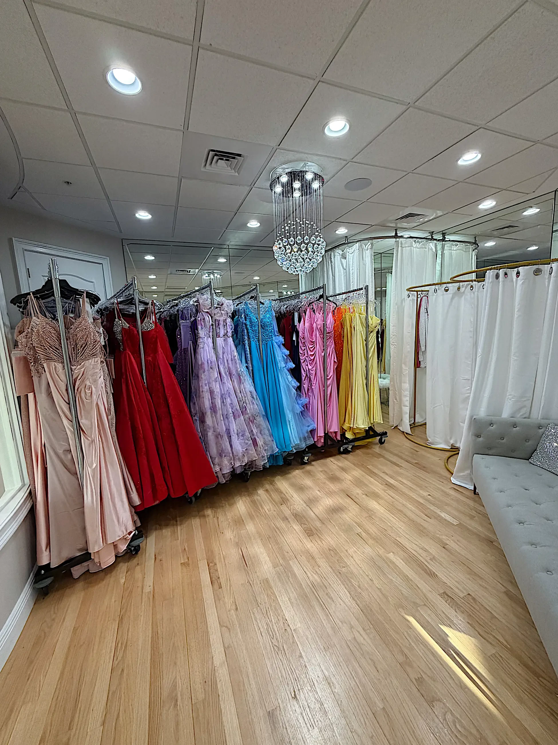 image shows a rack of special occasion gowns