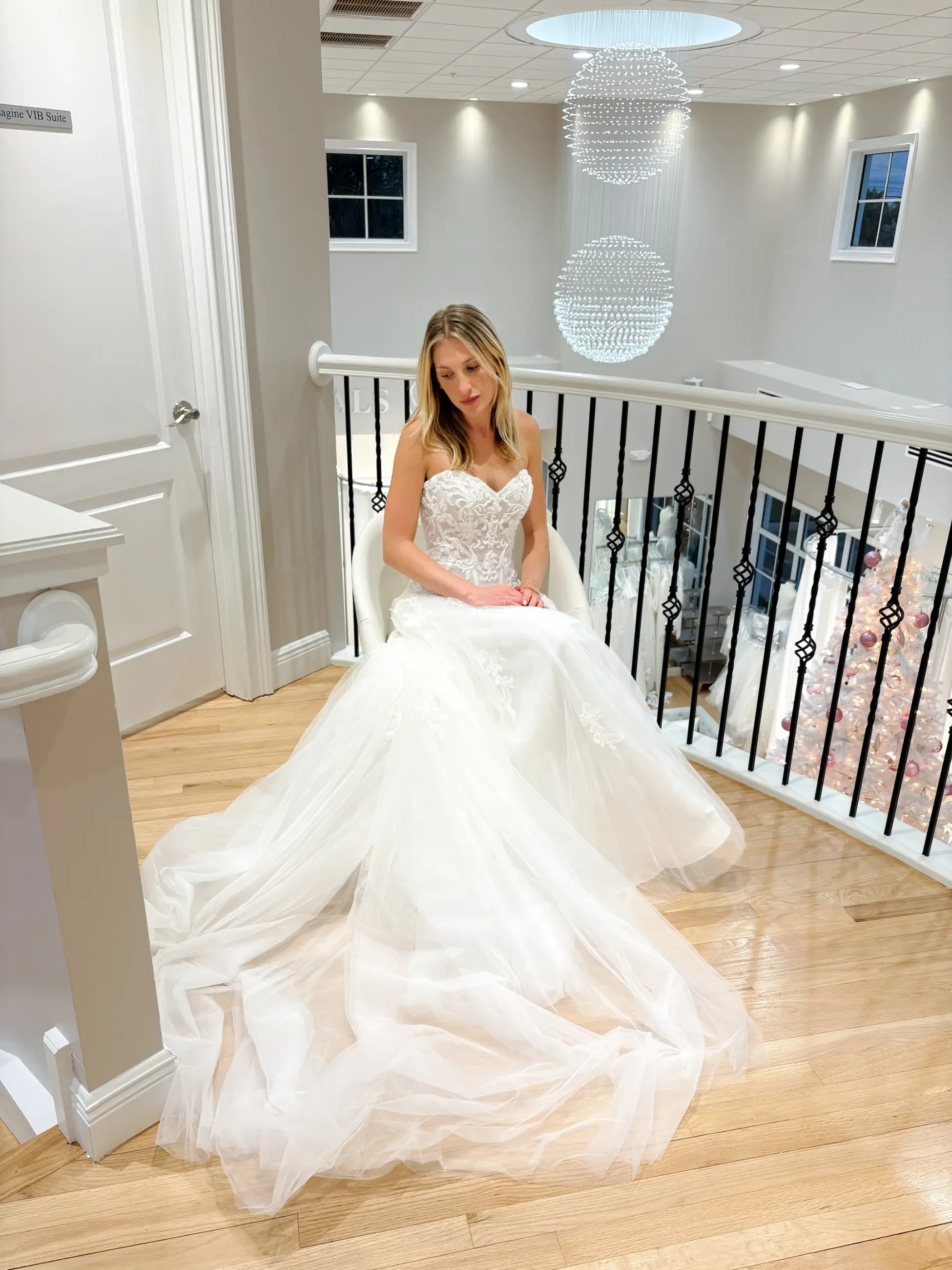 model is wearing a strapless tulle wedding dress